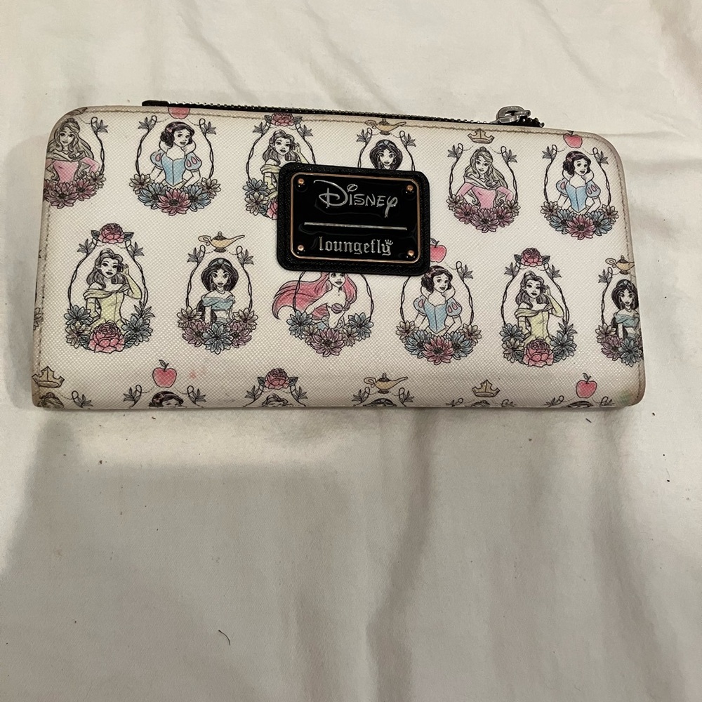 Disney loungefly cute princess wallet with 2 snap compartments and one top zip.